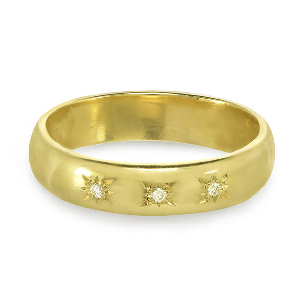 Men or women's gold wedding band with three diamonds on the front.