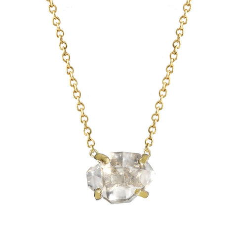 Delicate Herkimer Crystal pendant necklace with a gold chain.