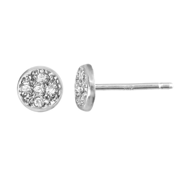 Circular stud earrings with bezeled pebble diamonds in sterling silver.