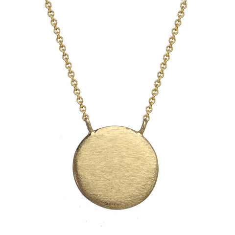Large gold circle necklace.