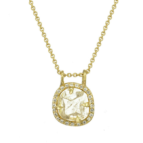 Diamond slice pendant necklace with gold chain.
