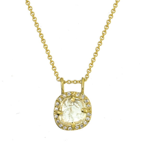 Diamond slice pendant necklace with gold chain.