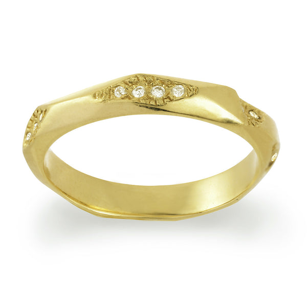 Plain gold textured wedding band for men and women with small diamonds.