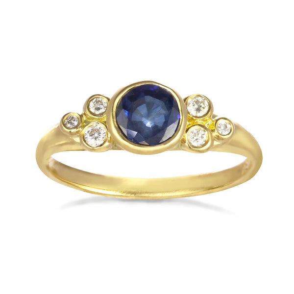 Constellation Ring with a morganite or sapphire center stone. Six small diamonds on the side.
