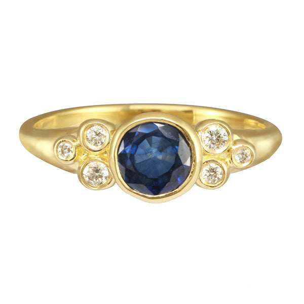Constellation Ring with a morganite or sapphire center stone. Six small diamonds on the side.