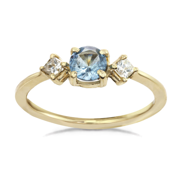 14 karat gold ring with sky blue center aquamarine stone and two diamonds