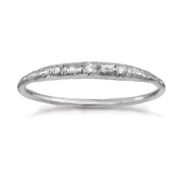 Thin sterling silver band with tiny crescent shaped diamonds in the front.