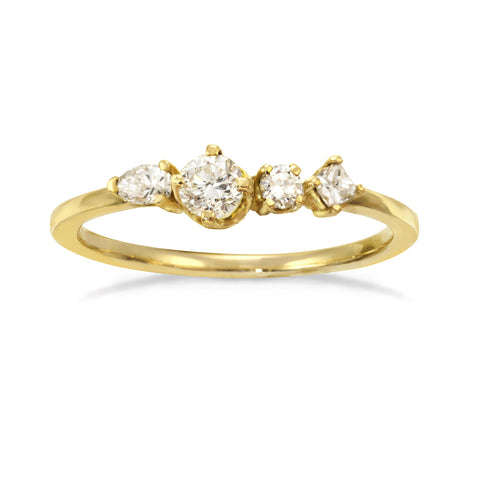 Gold engagement ring with four unique diamonds.