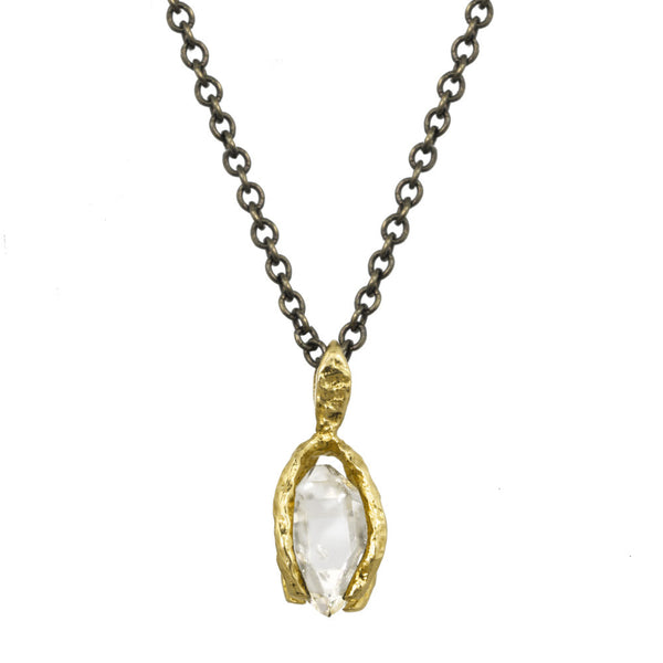 Herkimer Crystal pendant with a gold bail on an oxidized silver chain.