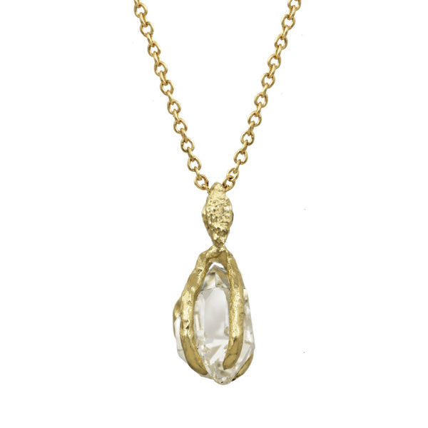 Herkimer Crystal pendant with a gold bail on a gold chain.