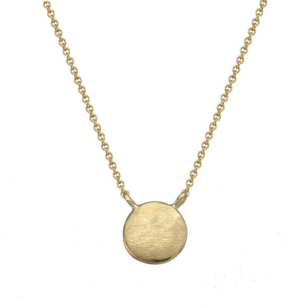 Small gold circle necklace.