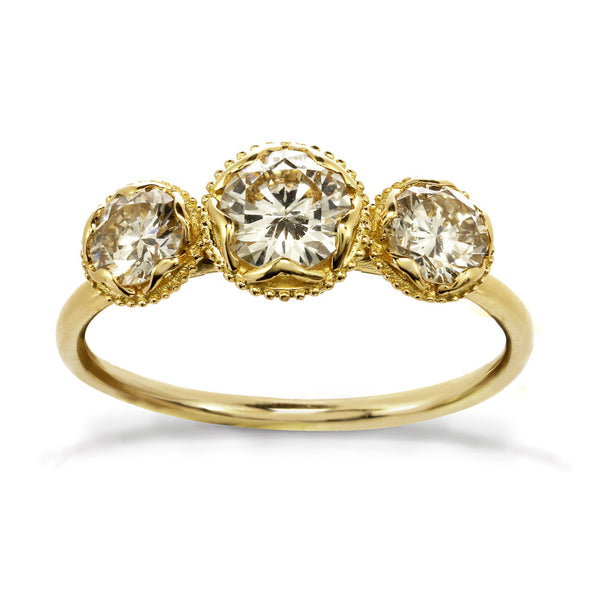 Gold engagement ring with three champagne diamonds 