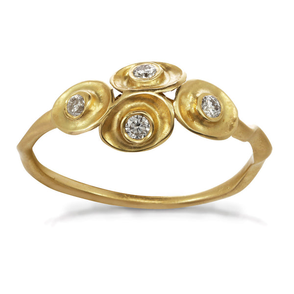 Waterlily inspired gold ring with four diamonds.